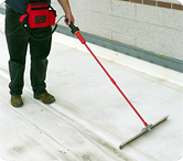 Technician performing high voltage leak detection